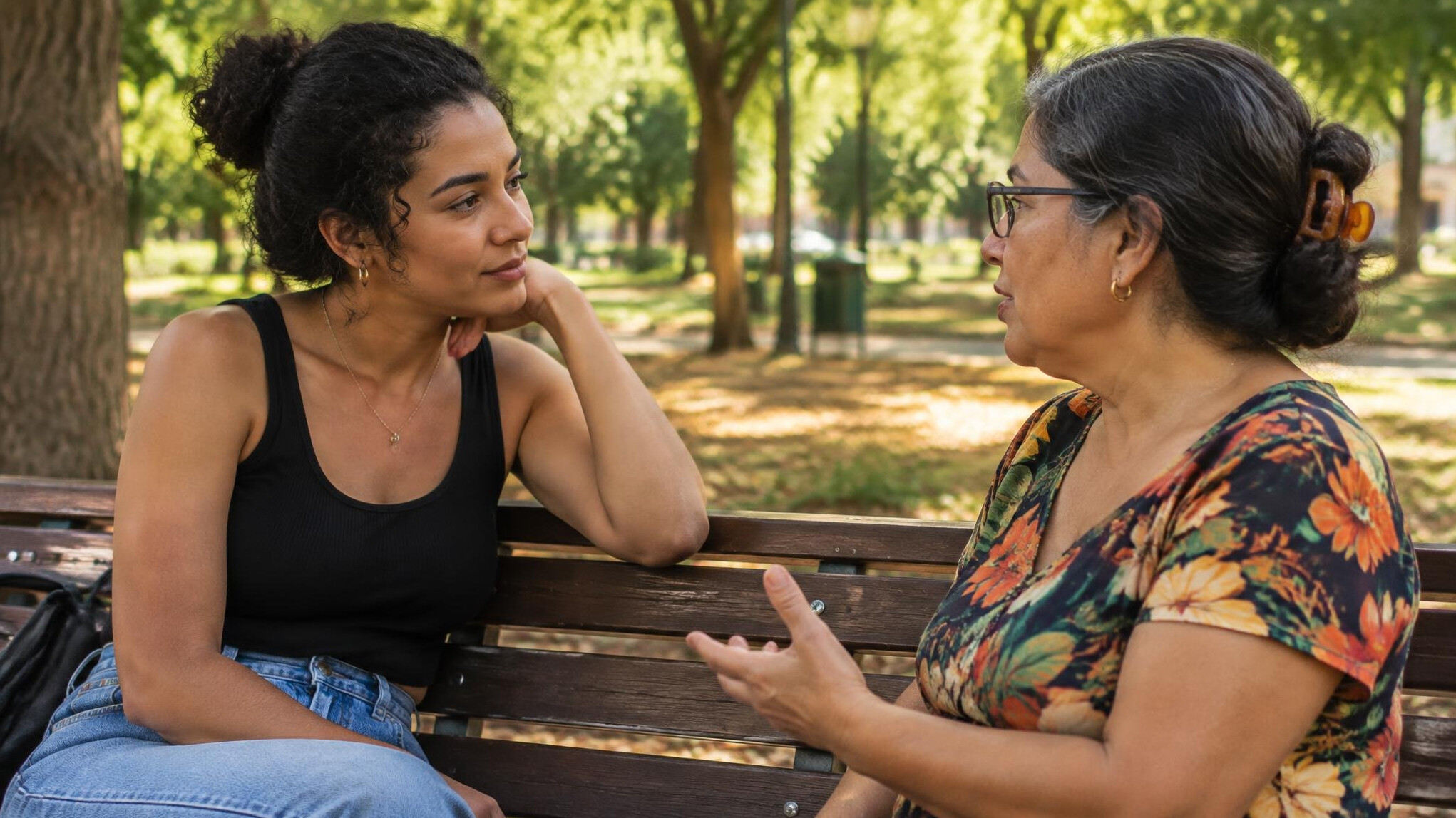 Two people sitting face to face having an attentive conversation